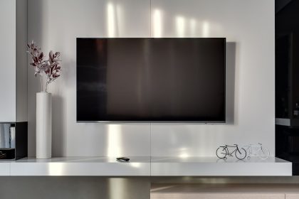 Modern slim TV mounted to a living room wall