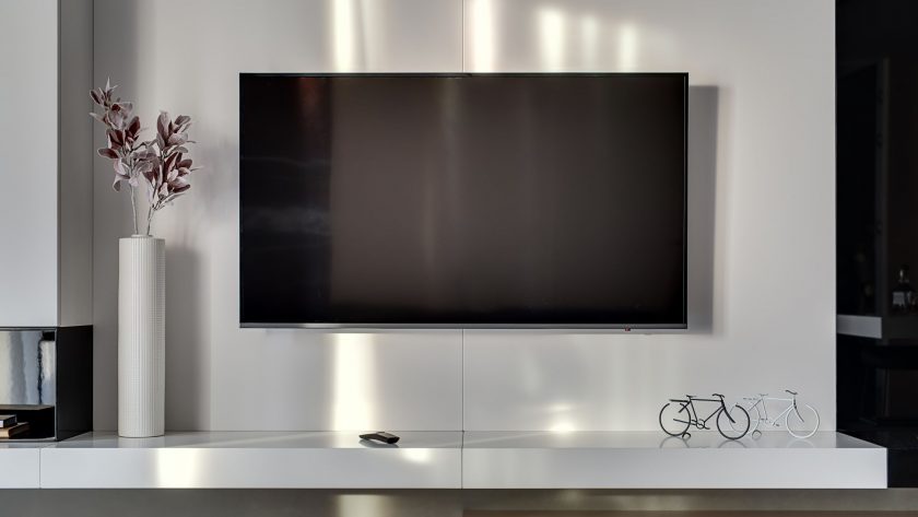 Modern slim TV mounted to a living room wall