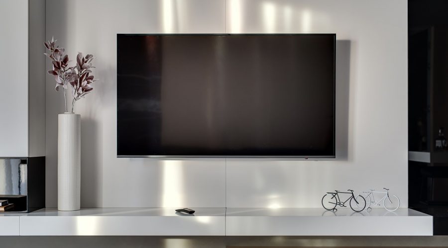 Modern slim TV mounted to a living room wall