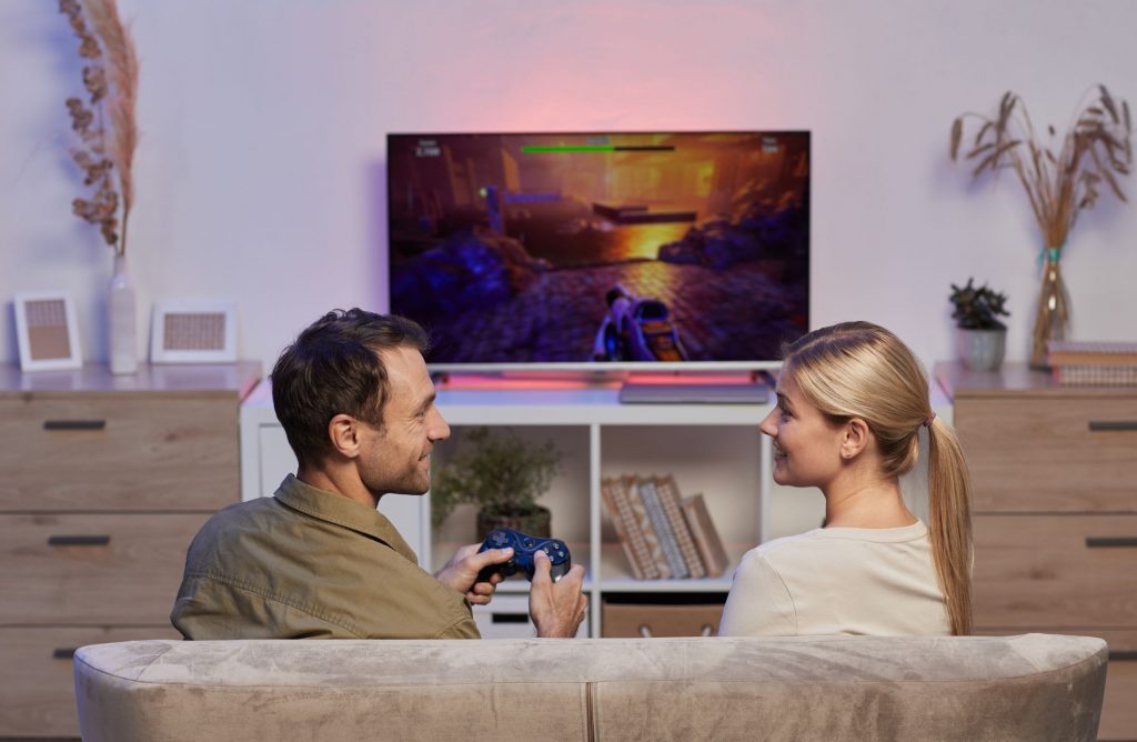 Couple using gaming device over a HDMI extender