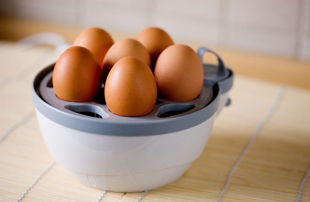 An egg boiler with 6 hard boiled eggs